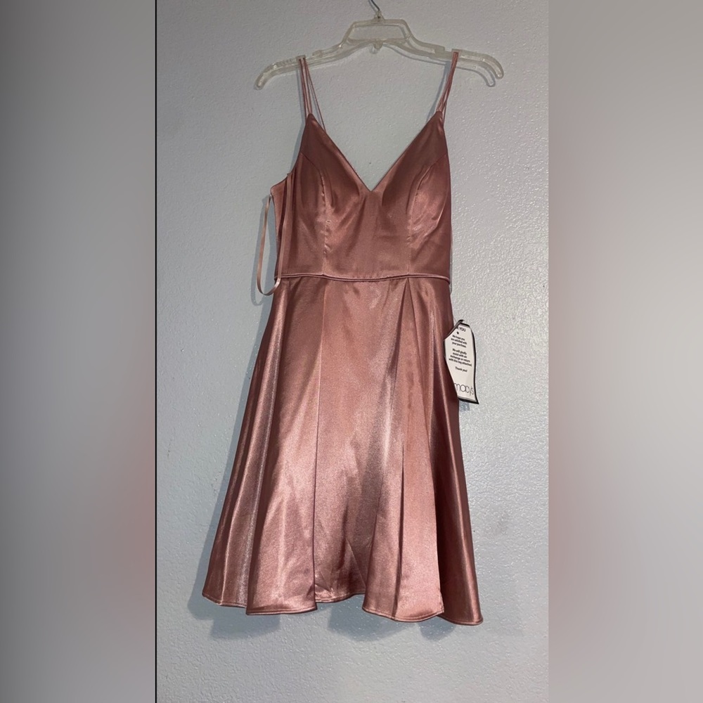 Sequined hearts rose gold dress brand new and has tags pretty silk material.